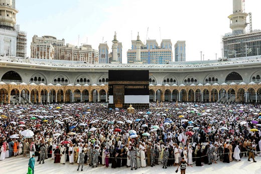 Circumambulating around the Kaaba in the Grand Mosque in Mecca.