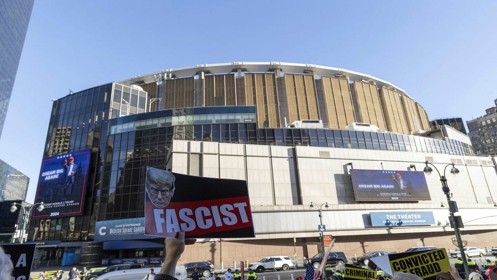 Donald Trump is called a fascist by protesters outside the Madison Square Garden arena in New York, where the ex-president held a campaign rally on Sunday.