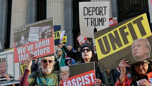 Protesters show their displeasure with Donald Trump outside the square in New York.