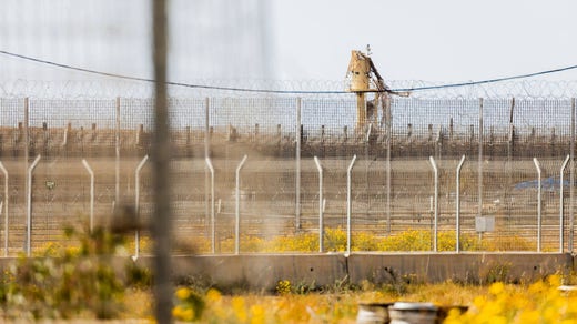 A fence on the Israeli side of the border crossing at Kerem Shalom.