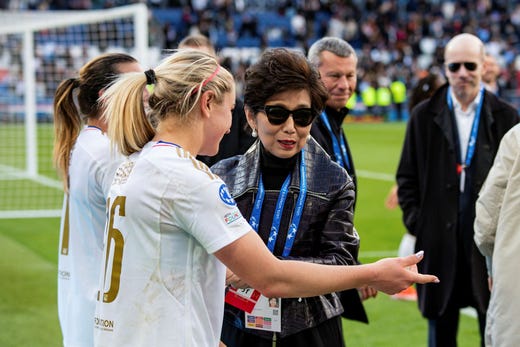 Lyon star Lindsey Horan and club owner Michele Kang after last spring's Champions League semi-finals.