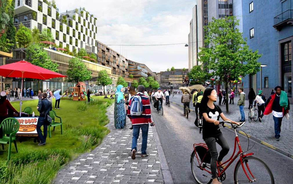 Borta är bilar och internationella kontor och reklampelare i ekostaden City. Cyklister och gående dominerar på gröna stråk utan särskilt mycket affärsliv. En del kontor har byggts om till gröna ytsnåla bostäder.