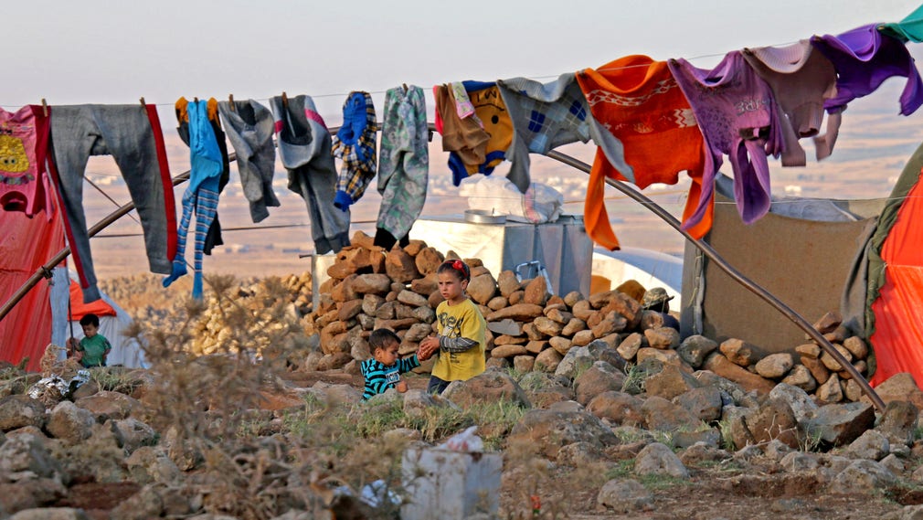 Syriska flyktingar i byn Burayqah, på gränsen mellan södra Syrien och de landområden på Golanhöjderna som ockuperas av Israel.