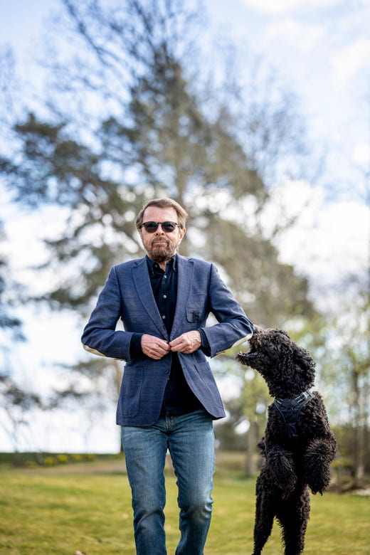 Björn Ulvaeus exercises regularly to keep fit. Here he is with his dog, Ares.